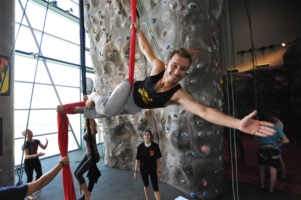 Students climbing a wall