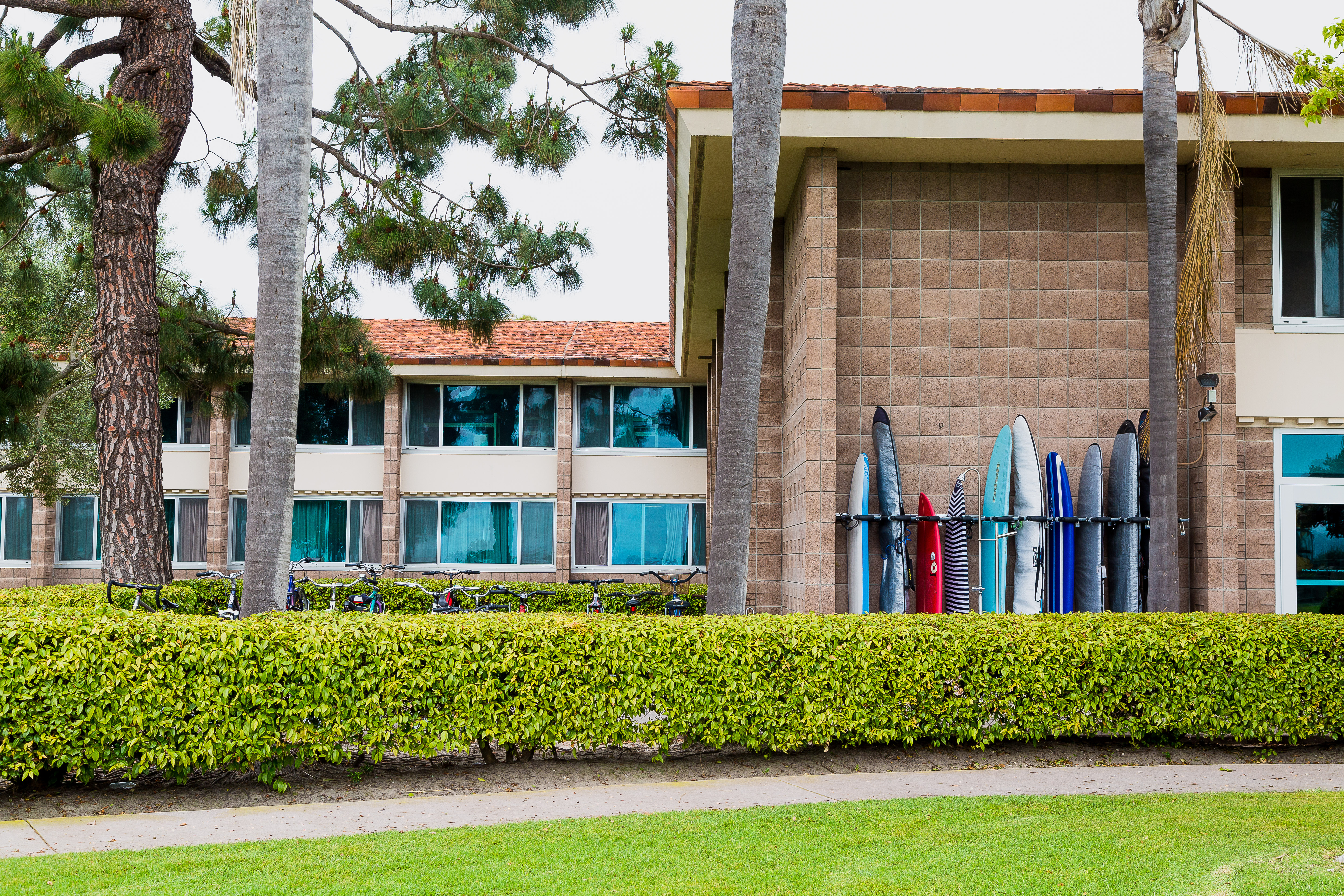 outside santa cruz hall with bikes and surfboard racks