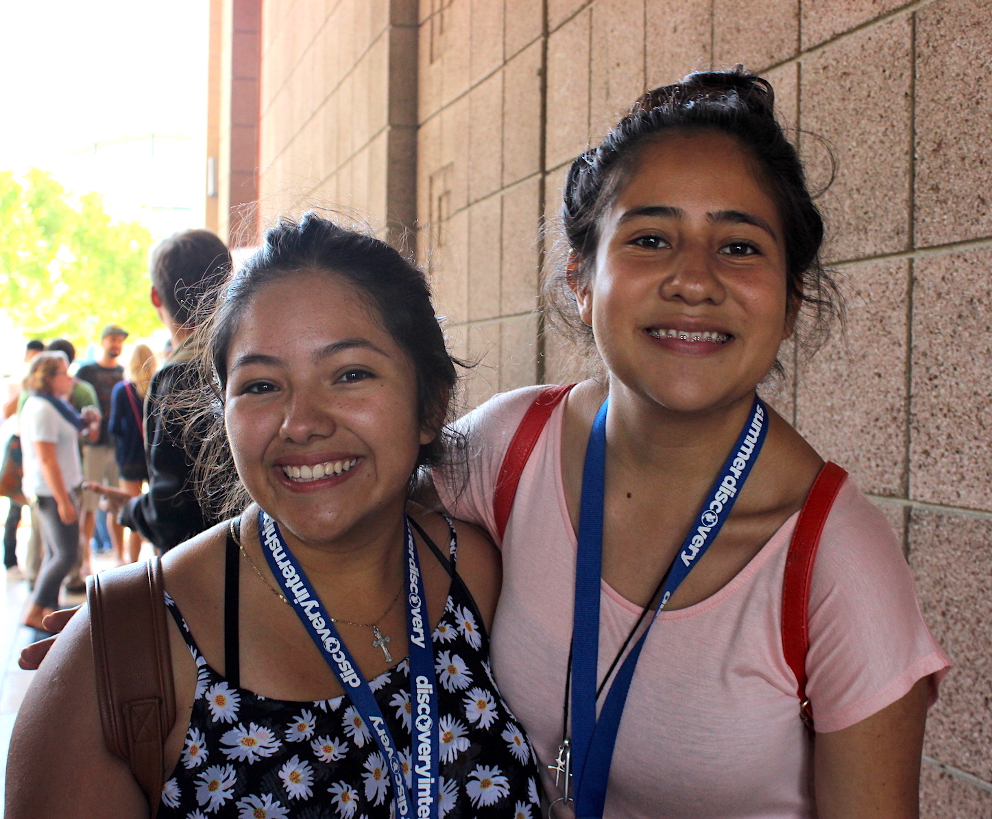 two pre-college students smiling