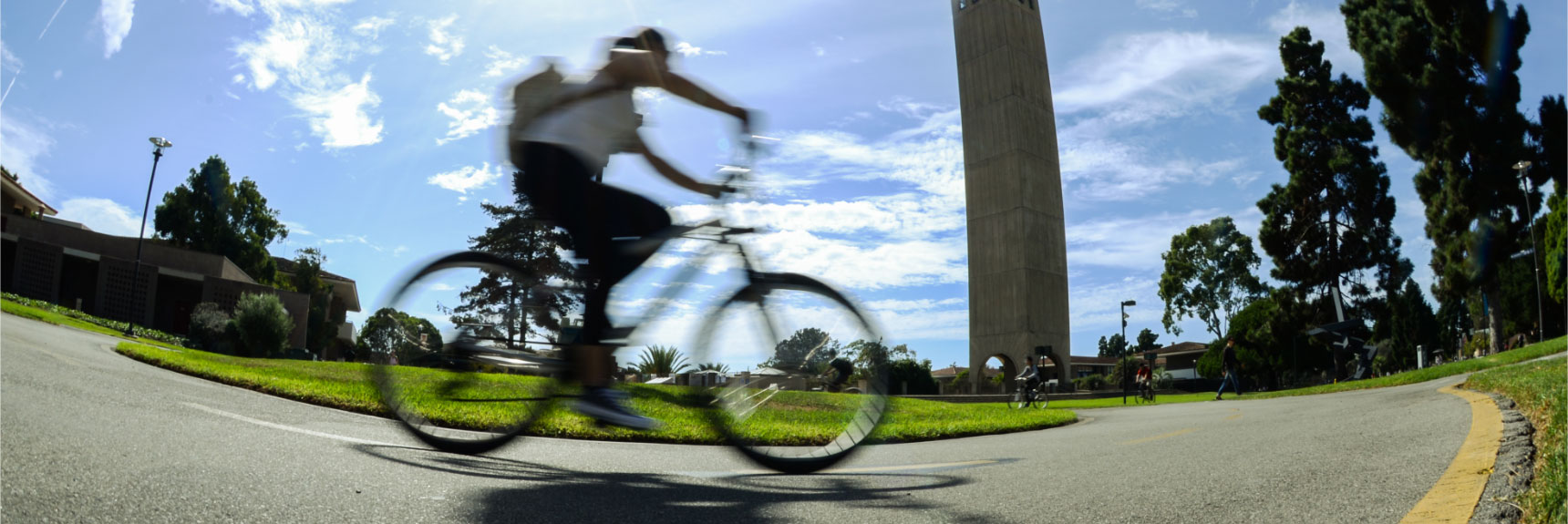 student riding bicycle