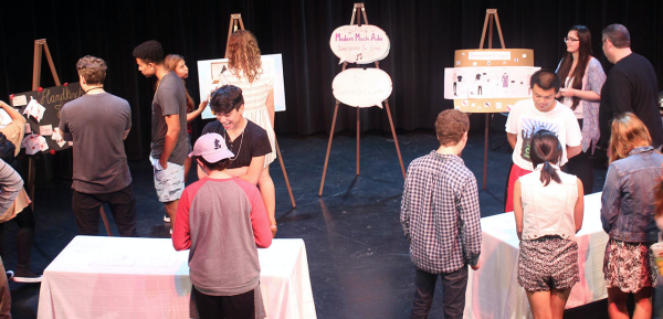 Students engaging in a showcase